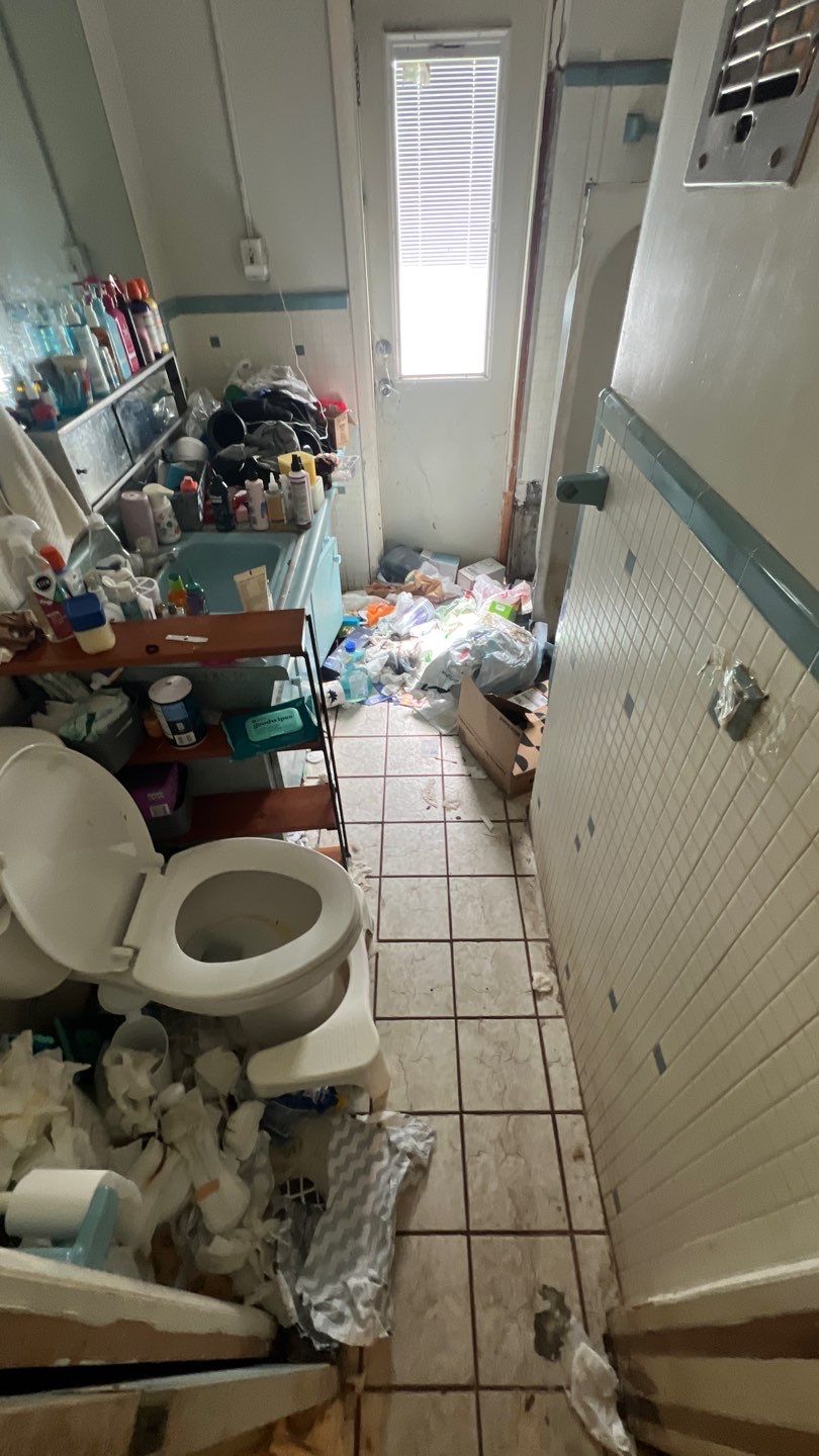 Bathroom before hoarding and biohazard cleanup in West Palm Beach