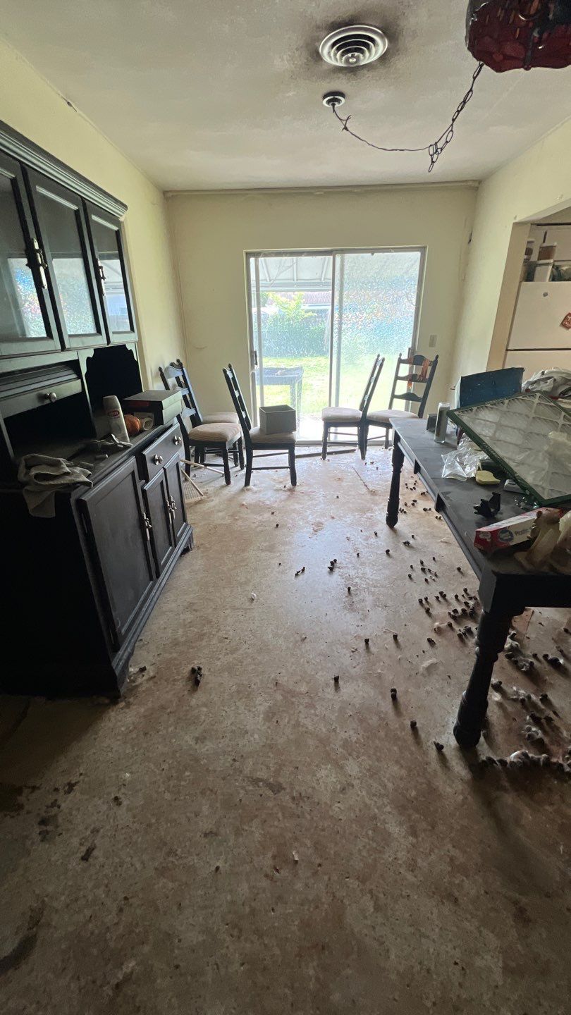 Dining area before hoarding and biohazard cleanup in West Palm Beach